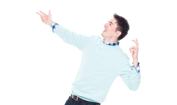 istock Handsome young man looking up in surprise 1170298014