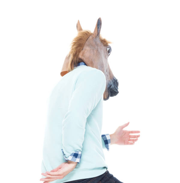 istock Man with horse mask is dancing 1170298150