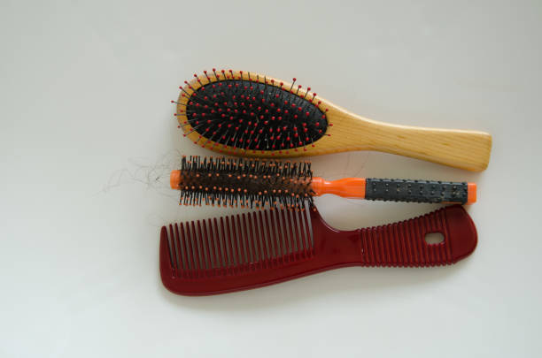 istock Combing with hair loss on a white background 1170298443