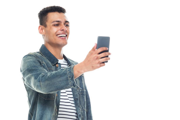 istock Good looking tall black man wearing denim jacket - taking a selfie 1170298687