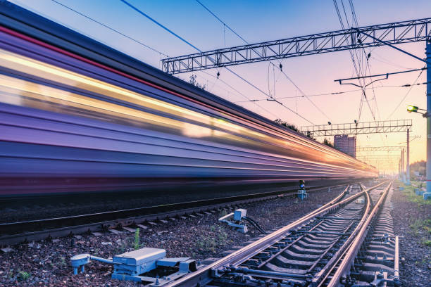 two trains move fast to the different directions. - high speed train imagens e fotografias de stock