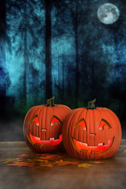 istock Halloween glowing pumpkins with fog 1170303569
