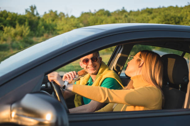 istock Young lovely couple having fun on road trip 1170304051
