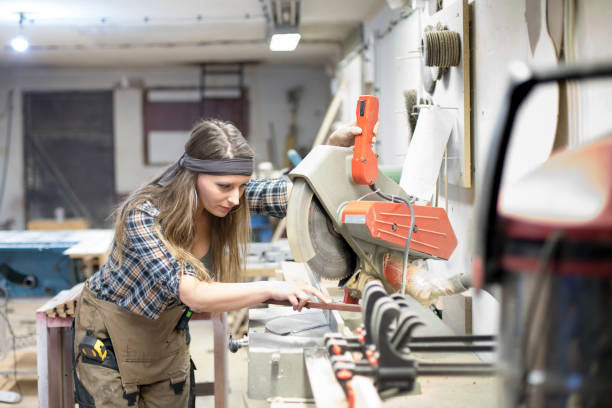 istock blonde girl working in carpenter's workshop 1170304204