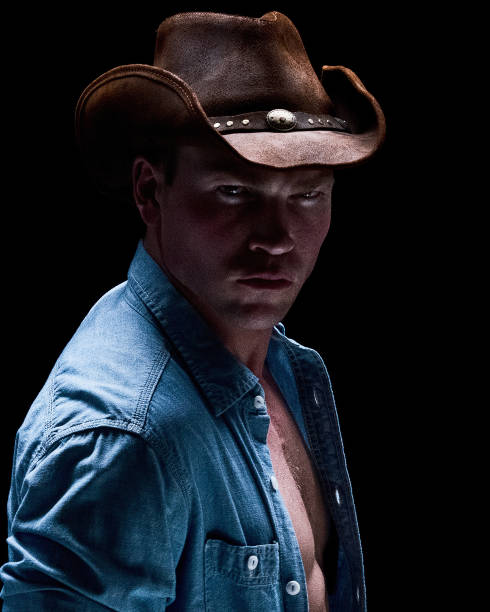 istock Cowboy posing in a sexy manner 1170305246