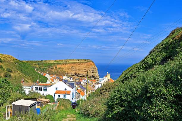 istock Public footpath into Staithes from Penny Nabb Cliffs, Yorkshire Moors, England 1170305859