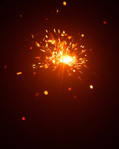 istock Christmas sparkler in haze with red light 1170306447