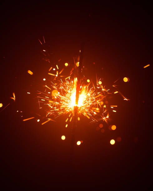 istock Christmas sparkler in haze with red light 1170306458