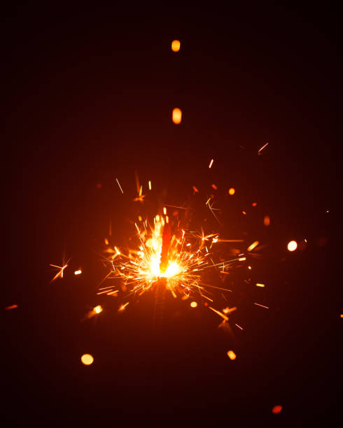 istock Christmas sparkler in haze with red light 1170306473