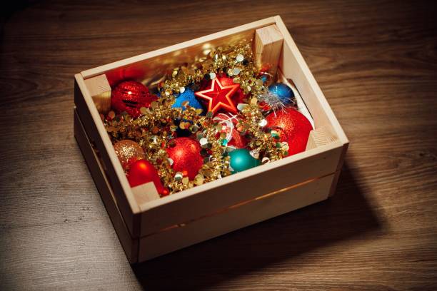 Christmas decorations stored in wooden box Christmas decorations stored in wooden box, close-up view christmas decoration storage stock pictures, royalty-free photos & images