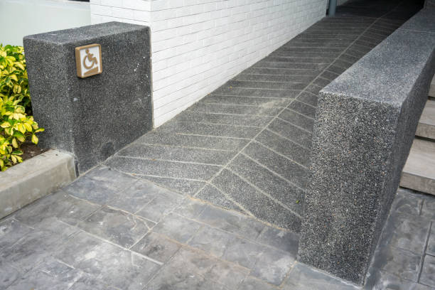 ramped access, using wheelchair ramp with information sign on wall for disabled people. - physical impairment wheelchair disabled accessibility imagens e fotografias de stock