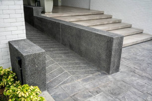 istock Ramped access, using wheelchair ramp for disabled people. Concrete ramp pathway. 1170306758