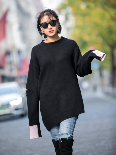 istock Asian girl in black sweater 1170308260