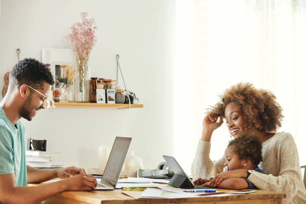 istock Happy parents with son working from home 1170309522