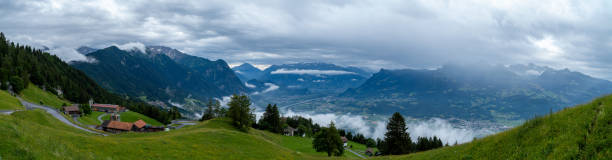 istock Panorama of a mountain range and a valley in the clouds - blue colors 1170310081