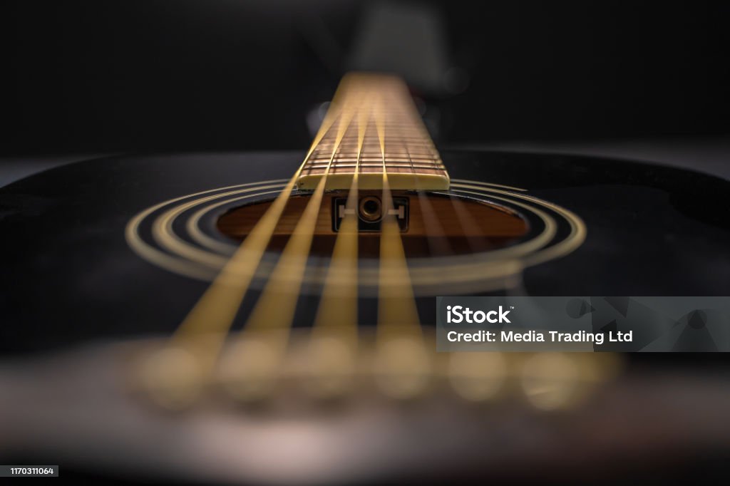 Detail of black classical guitar Detail of black classical guitar. The scene is situated in a studio environment in front of a black background. The picture is taken with Sony A7 III camera. Guitar Stock Photo
