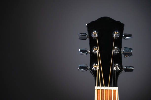 istock Black classical guitar  fretboard on a grey background 1170311107
