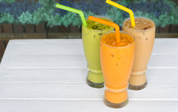 istock Green tea Thai tea and white tea on white table. 1170319044