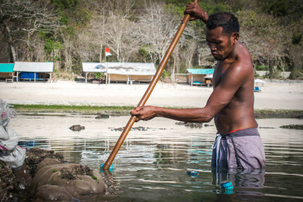 istock Asian fisherman and his fish net 1170325161