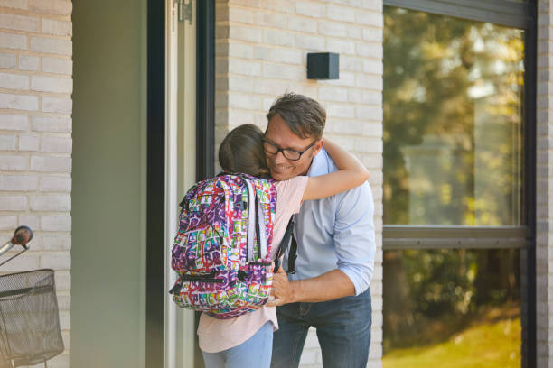 istock Girl embracing father before leaving for school 1170328704