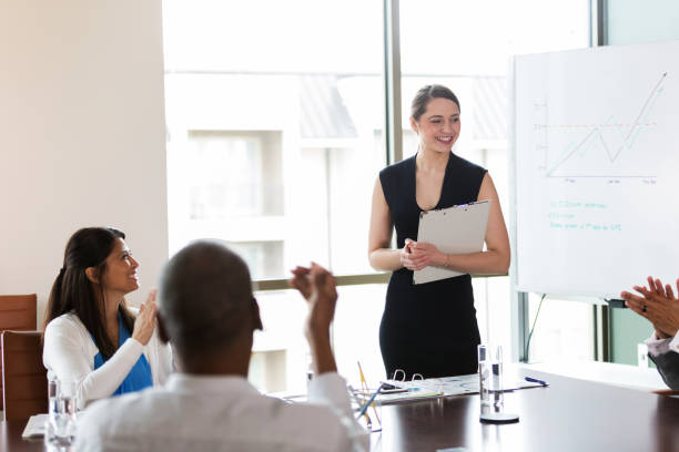 istock Confident young businesswoman gives presentation 1170329672