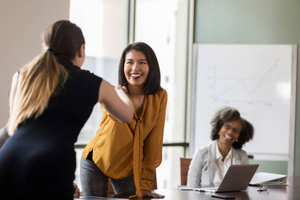 istock Businesswomen shake hands before meeting 1170329704