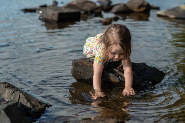 istock Girl Playing in Lake 1170331061