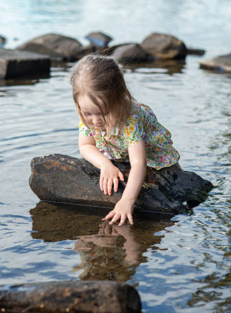 istock Girl Playing in Lake 1170331087