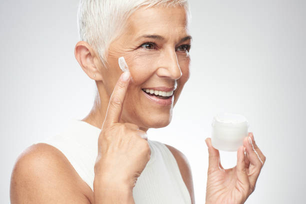istock Woman putting anti age cream. 1170335035