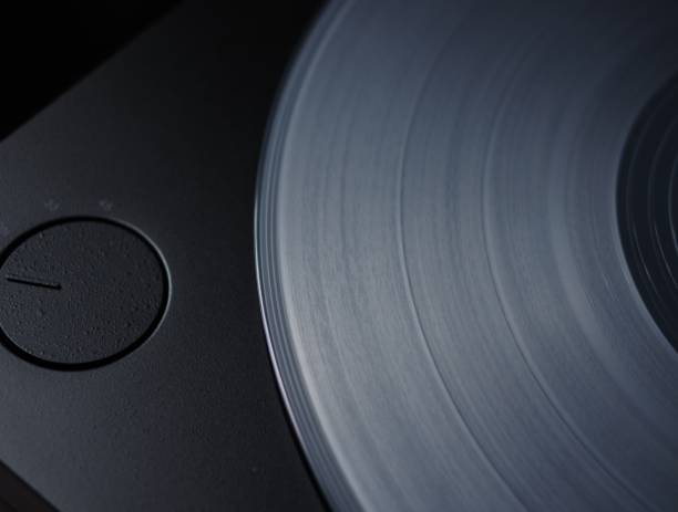 istock Transparent white clear vinyl record disc groove on turntable top view 1170336016