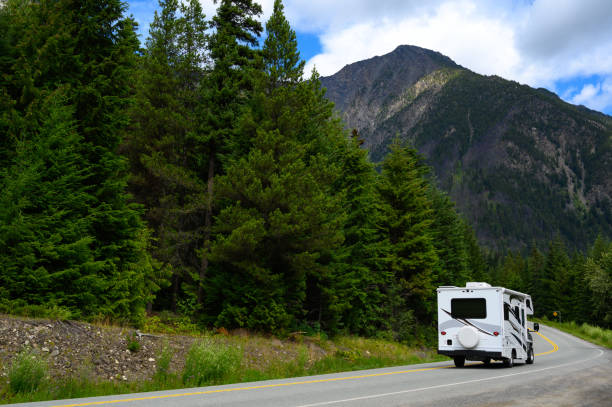istock Motor home moving on road against mountain 1170343770