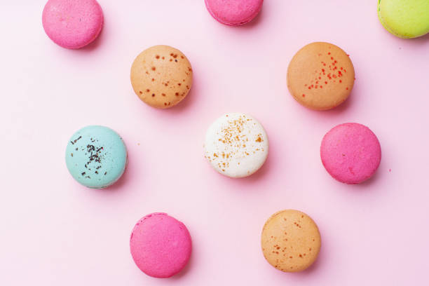 istock Flatlay with colorful macarons on pink background. Top view 1170344635