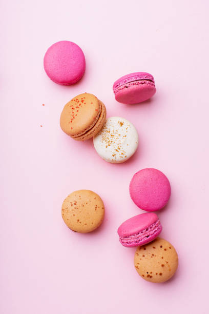 istock Flatlay with colorful macarons on pink background. Top view 1170344643