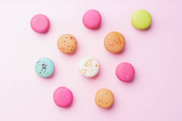 istock Flatlay with colorful macarons on pink background. Top view 1170344662