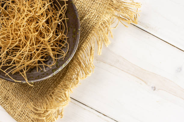 istock Raw thin noodles on grey wood 1170350447