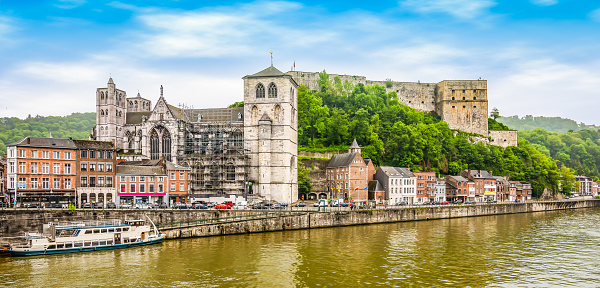 Bright and colorful wide angle view of river meuse and fort of Huy in Belgium.