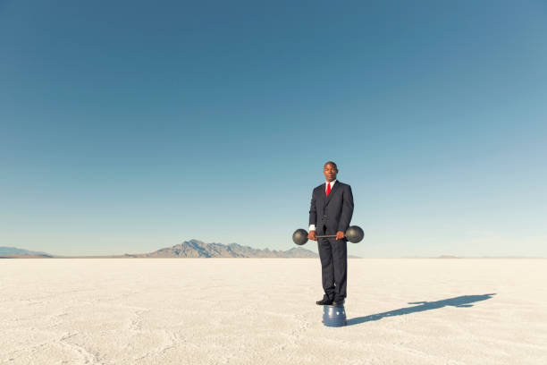 istock Businessman Lifting Weights for his Business 1170350647
