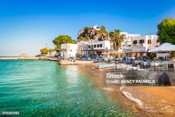 Patmos Island Greece Skala Village And Harbor View With Beach At The Port Stock Photo - Download Image Now