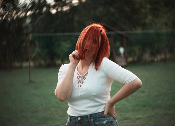 istock Red-haired woman posing in nature 1170355406