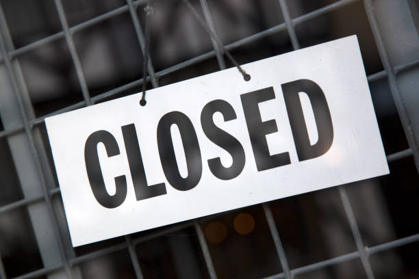 istock Closed Sign on Shop Door 1170355485