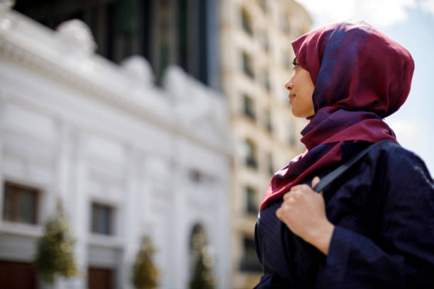 istock Smiling muslim woman travelling 1170357517