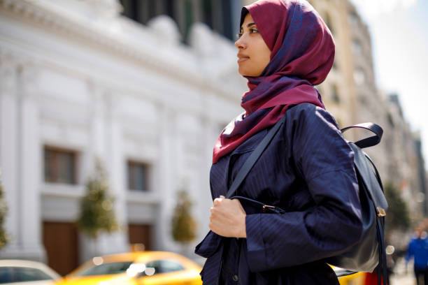 istock Smiling muslim woman travelling 1170357521