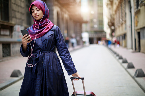 Young muslim woman travelling