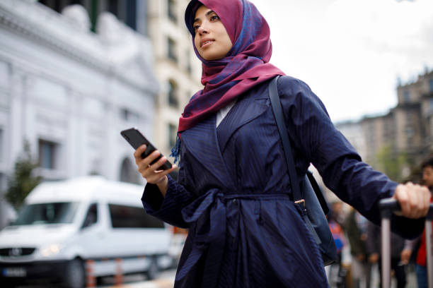 istock Smiling muslim woman travelling 1170357632