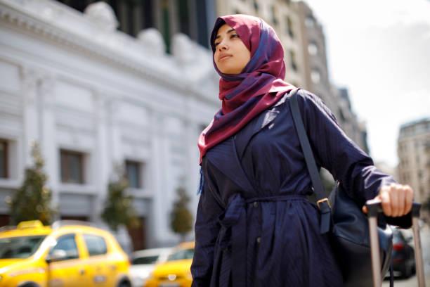 istock Young muslim woman travelling 1170357716