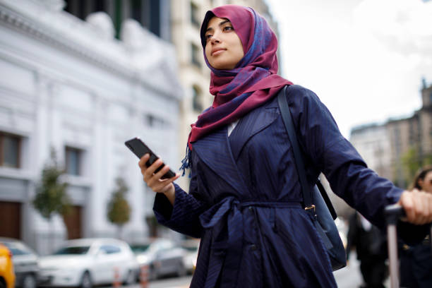 istock Smiling muslim woman travelling 1170357721
