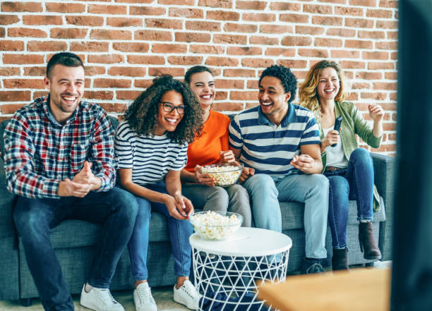 istock Group of friends watching tv 1170359523