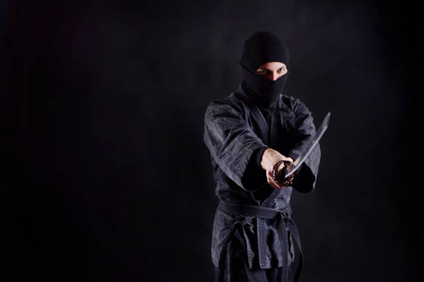 istock Ninja with katana portrait 1170361882