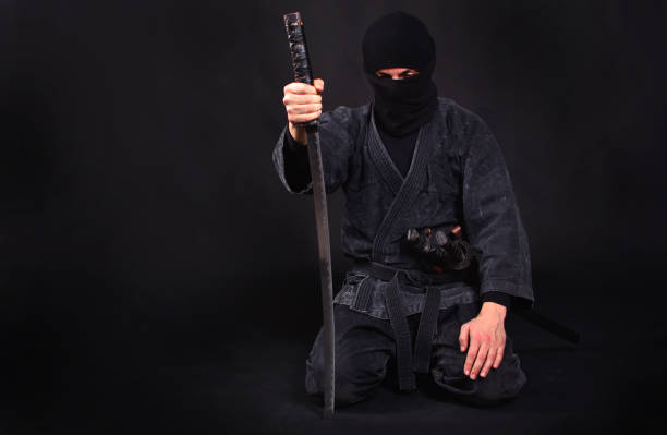 istock Tired ninja in kimono with katana sits on his lap 1170361899
