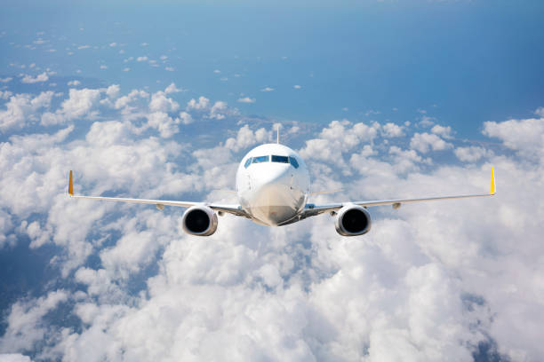 istock Passenger jet airplane flying above clouds 1170361952